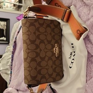 Coach crossbody bag. Brand new but tags gone. Never used. Storage cloth included
